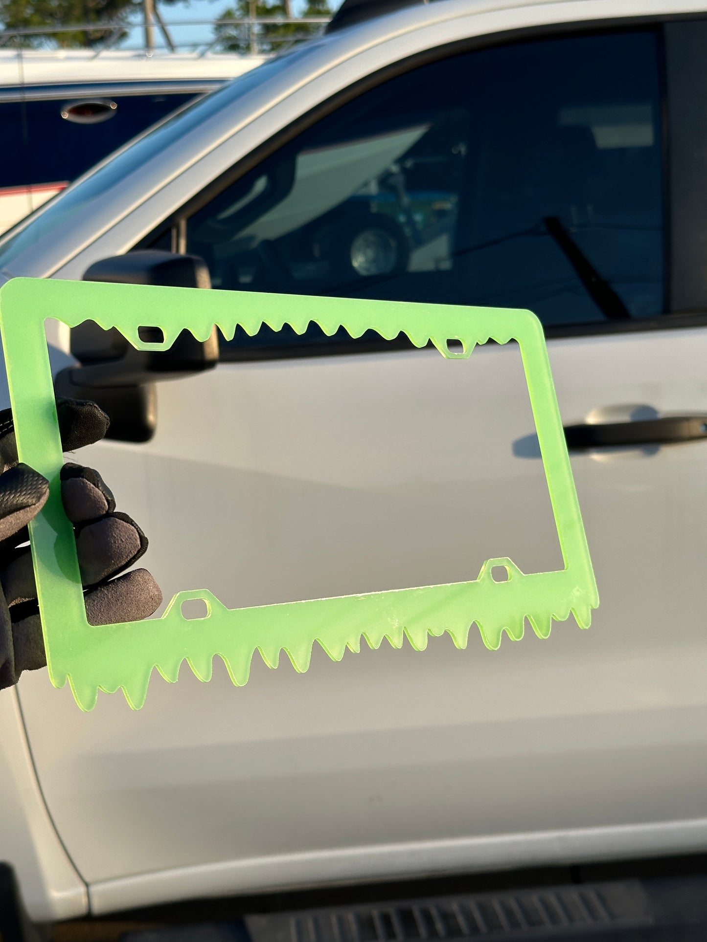Custom glowing license plate frame with drip style bottom edge