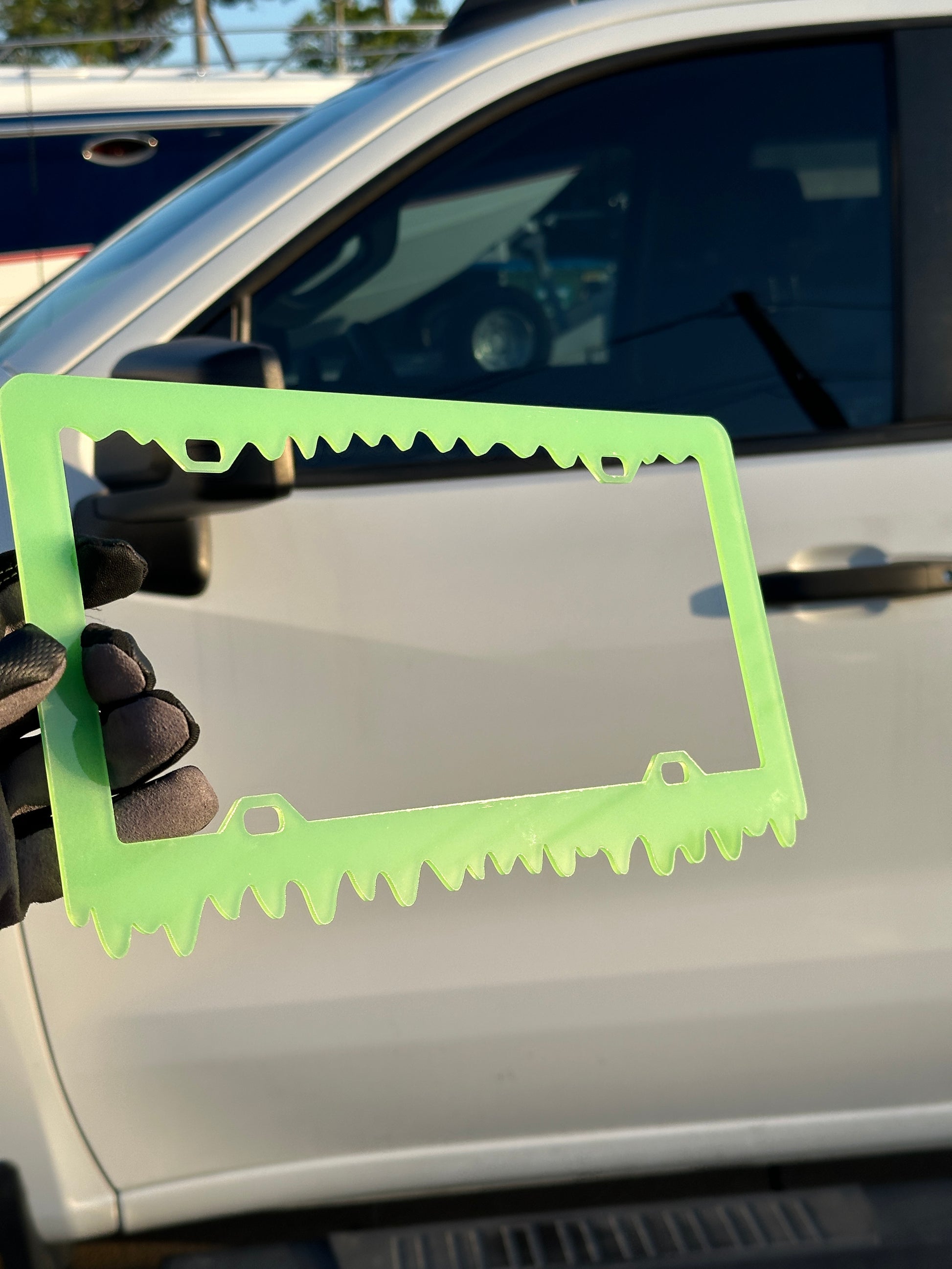 Custom glowing license plate frame with drip style bottom edge
