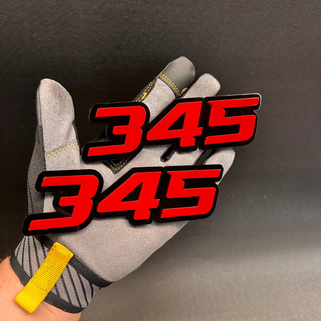 Custom Fast 345 fender emblem with glossy black base and red top