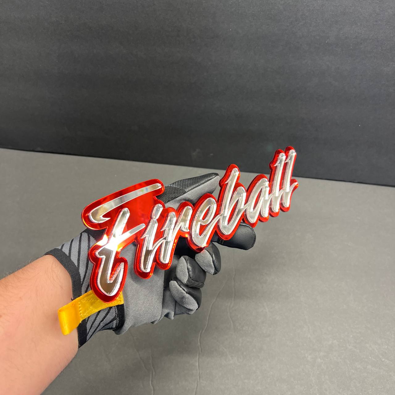 Custom Fireball text badge with glossy red outline and chrome mirror finish
