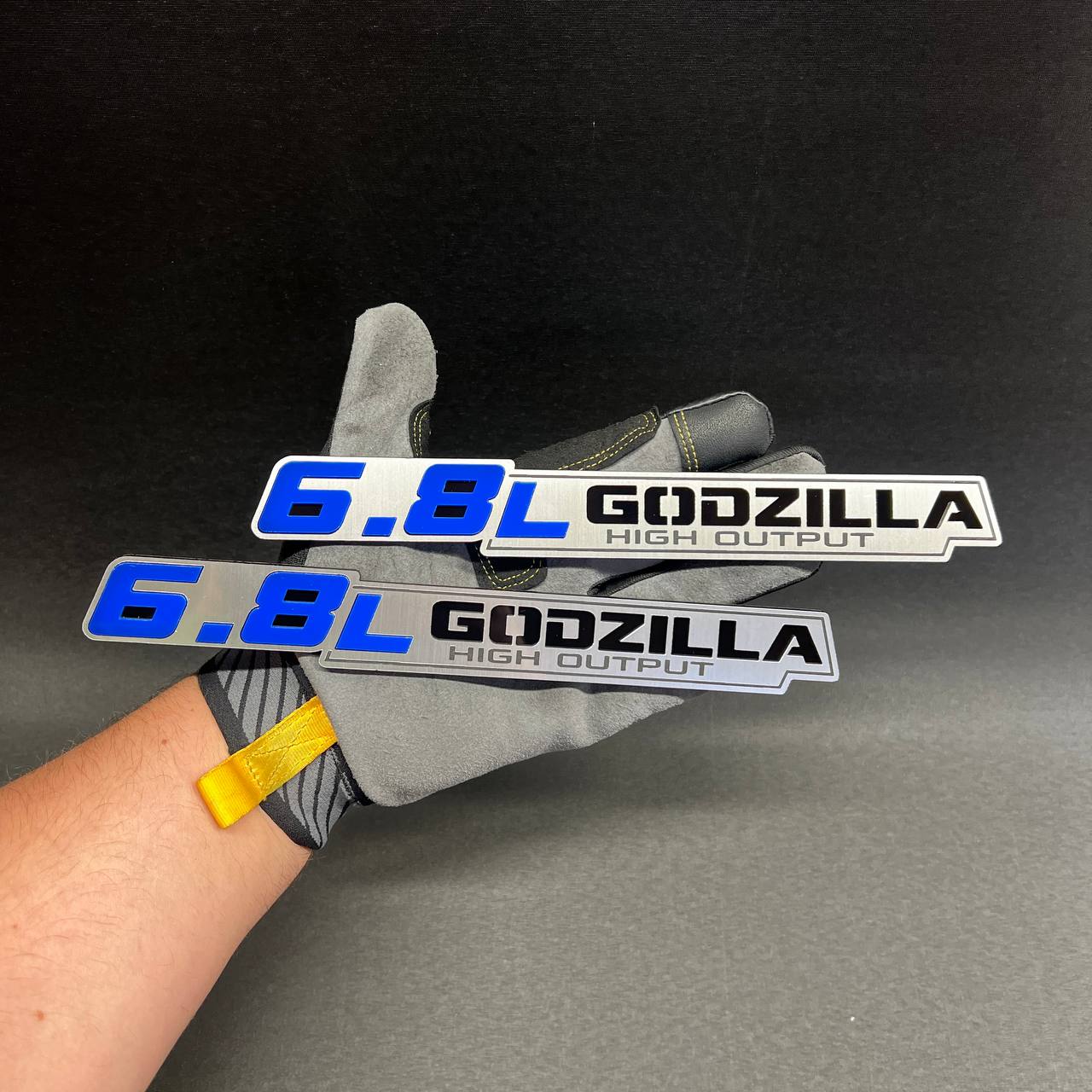 6.8L Godzilla High Output car badge fender emblem with blue lettering and brushed silver finish
