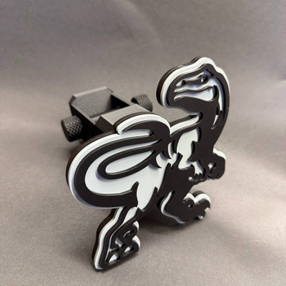 Black and white Raptor trailer hitch receiver cover for Ford F150 truck