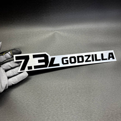 Ford Super Duty 7.3L Godzilla side badge with glossy black backing and bright pink top layer.
