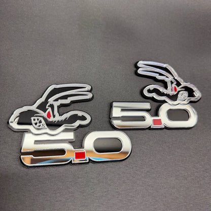 Coyote 5.0 mirror silver car badge with red eyes and detailed cartoon coyote design for Ford Mustang GT fender customization.