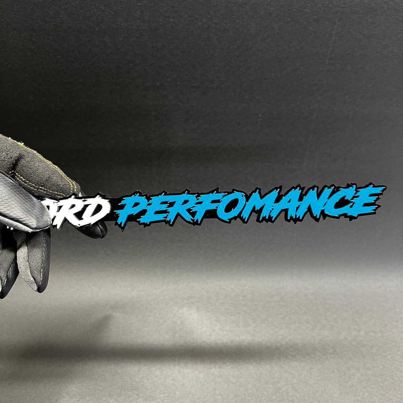 Ford Performance aftermarket car badge with glossy red finish
