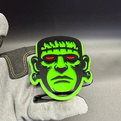 Halloween Frankenstein monster automotive badge with green black design and red eyes for cars and trucks