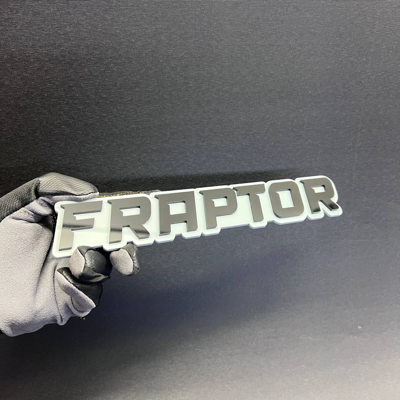 FRAPTOR text badge car emblem designed for fender, tailgate, or exterior vehicle decoration.