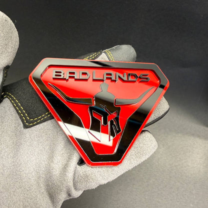Spartan warrior Gladiator truck emblem with Badlands lettering for custom 4x4 exterior.