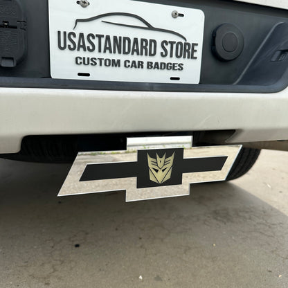Chevy truck hitch cover with silver emblem and Decepticon badge insert