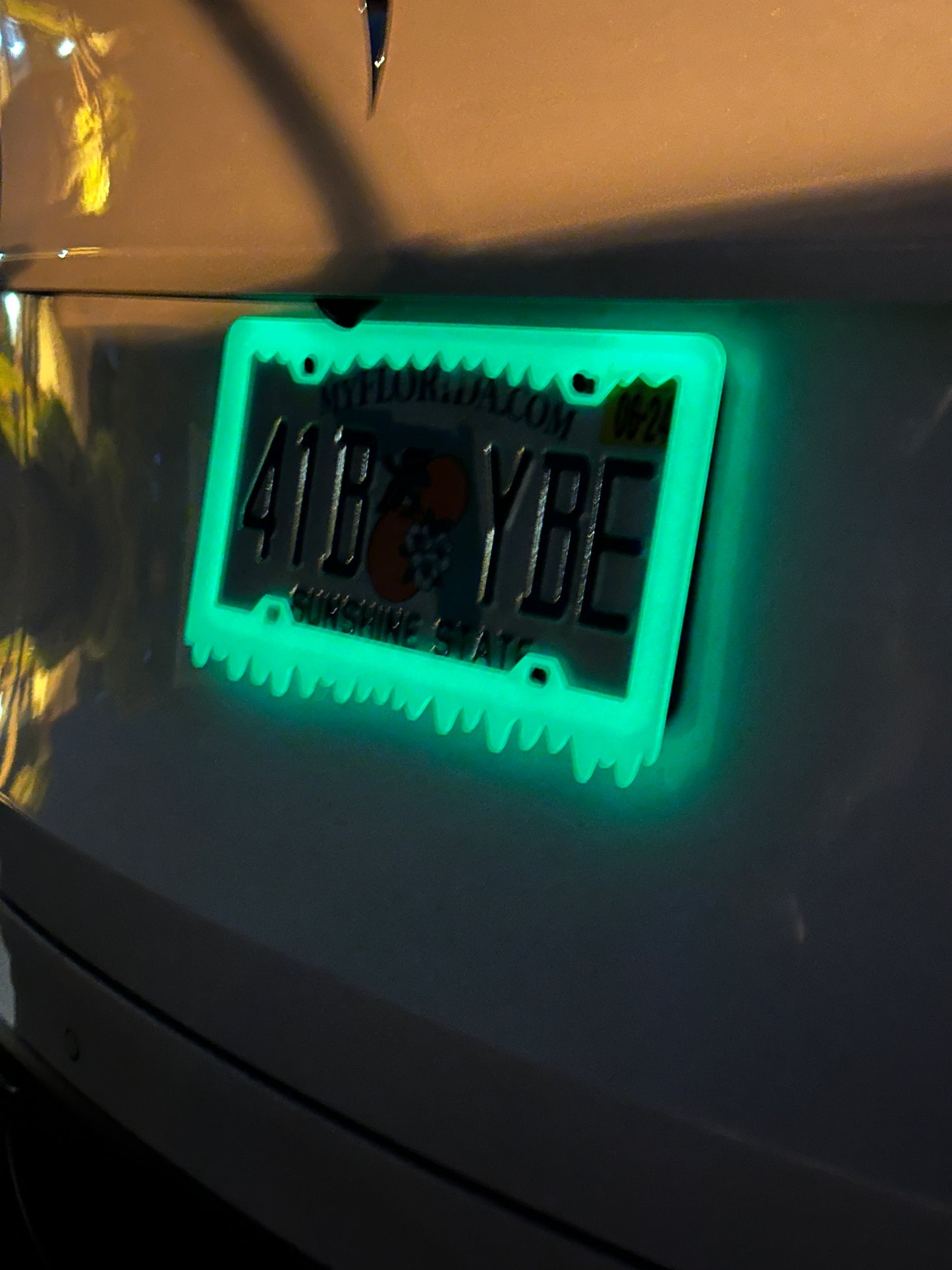 Green glowing license plate frame for car truck or SUV exterior