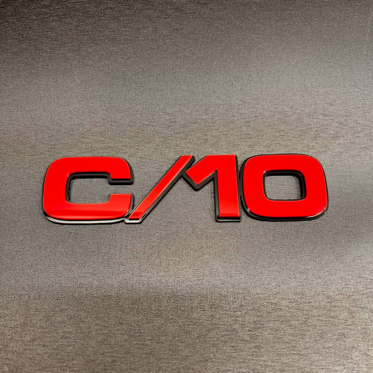Chevy GMC C/10 truck side emblem with custom multicolor billet-style design.