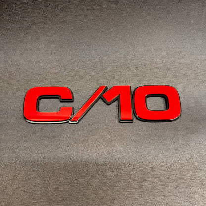Chevy GMC C/10 truck side emblem with custom multicolor billet-style design.