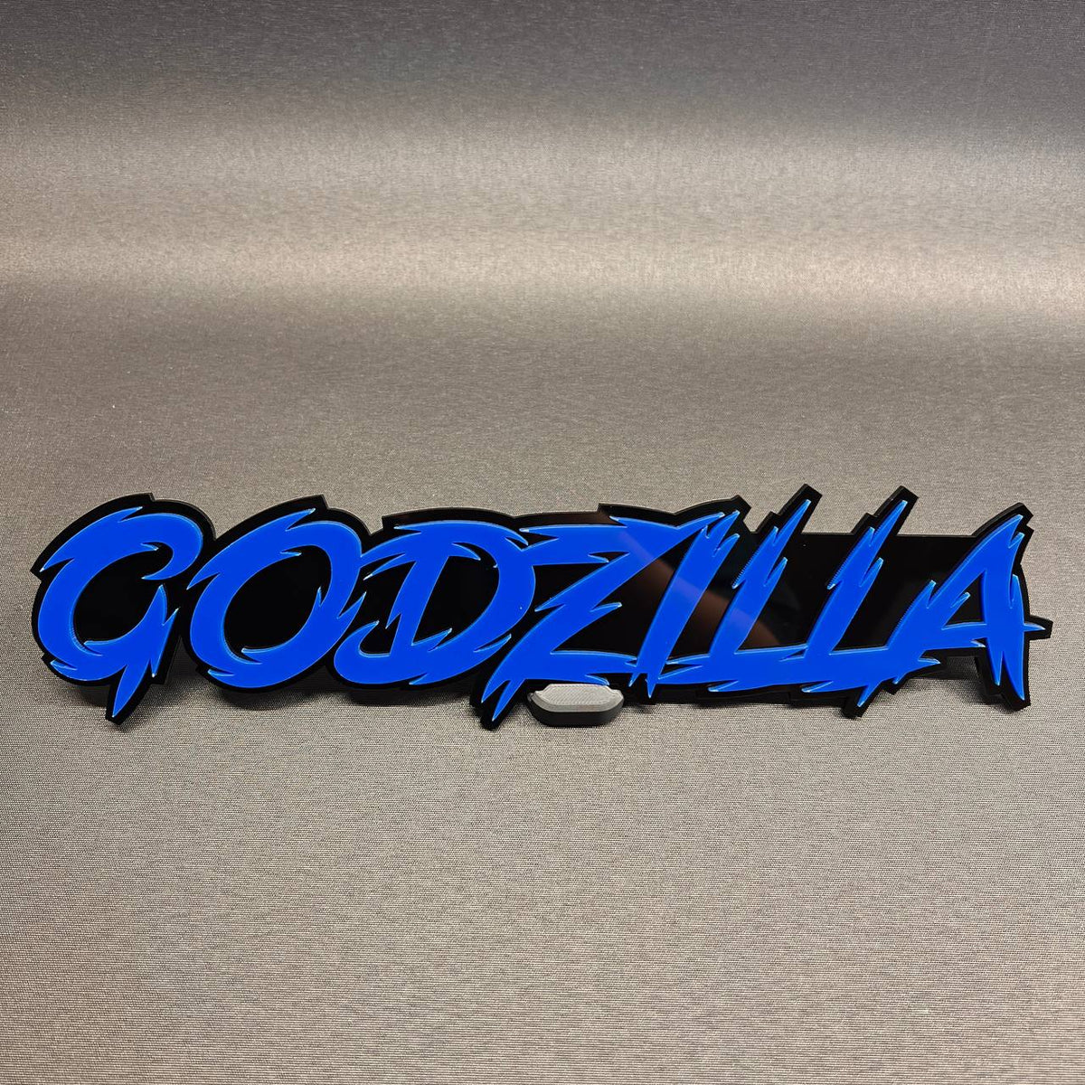 Blue and black Godzilla car text badge custom automotive emblem