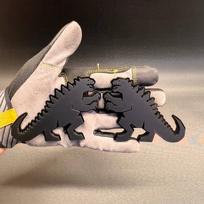 Black Godzilla car badge featuring a dinosaur monster design for automotive fender or tailgate customization.