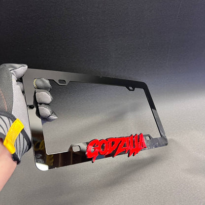 Red and black Godzilla car accessory frame for exterior license plate area