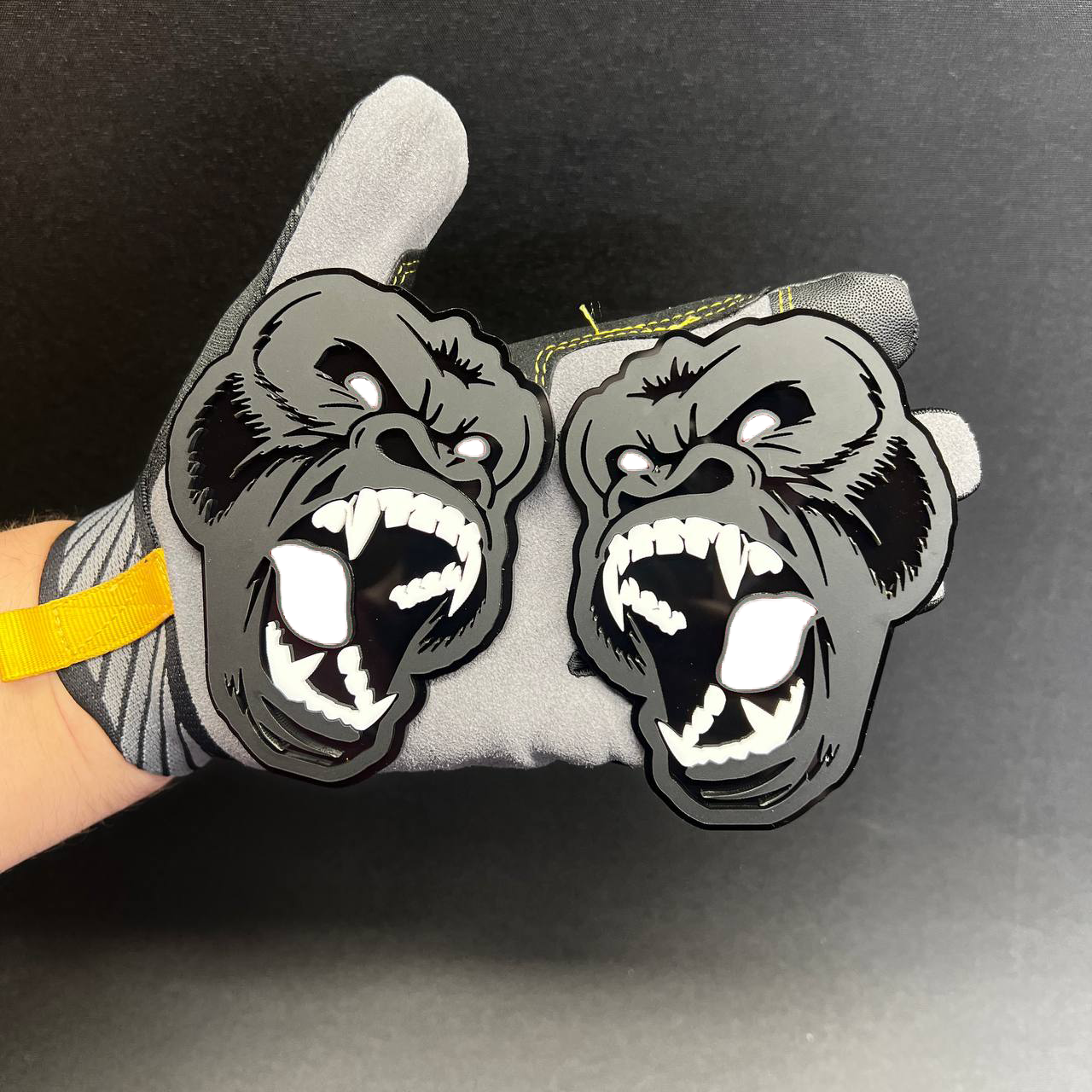 Aggressive gorilla Car Badge Fender Emblem in gray, black, white, and pink for auto exterior styling.
