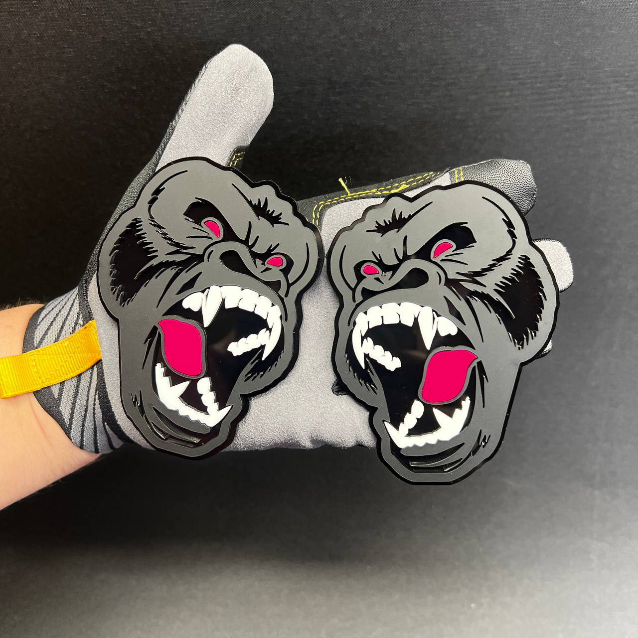 Pair of gorilla Car Badge Fender Emblem decals shown in gray and black with bright pink accents.