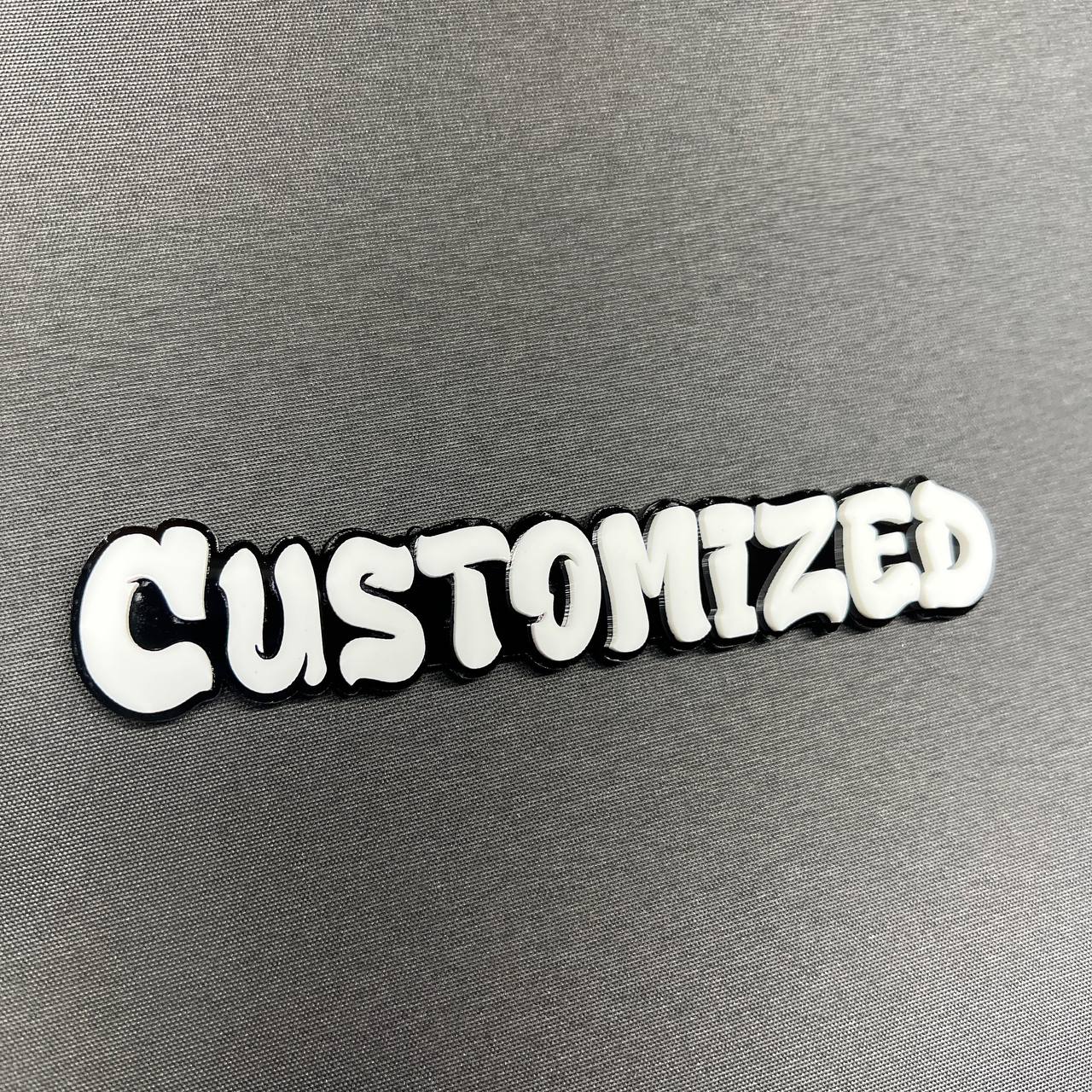 Custom text car badge with graffiti style font and bold outline
