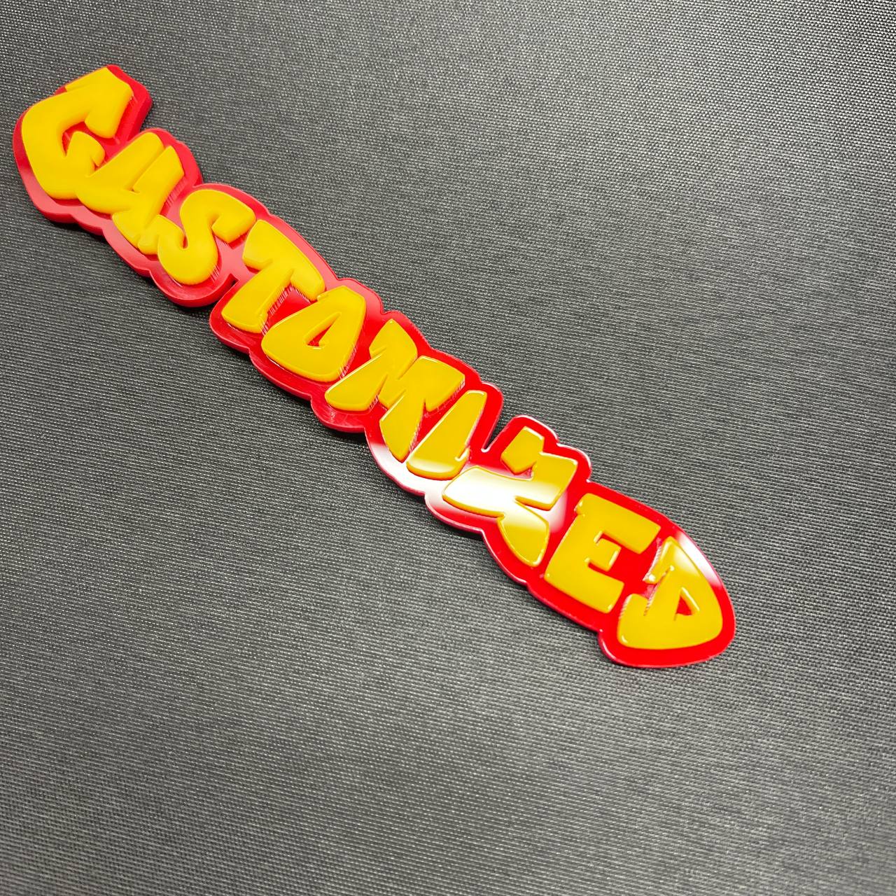Custom text badge in graffiti font with layered red and yellow design.
