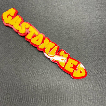 Custom text badge in graffiti font with layered red and yellow design.