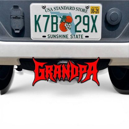 Red and black GRANDPA 3D hitch cover car badge mounted under rear bumper