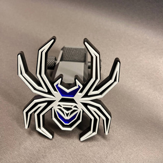 Gray on black Black Widow spider hitch cover with mirror blue accents for custom automotive styling.