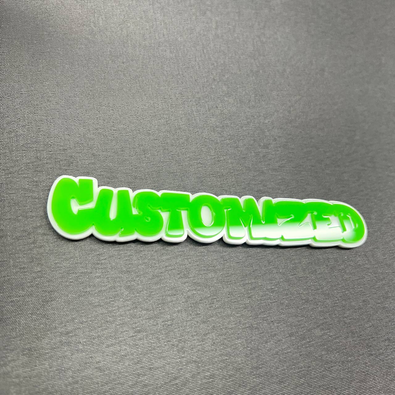 Custom word car badge with bold graffiti style lettering and clean outline