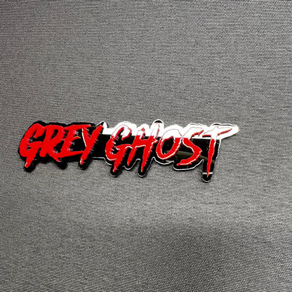 Grey Ghost custom text emblem badge made from layered acrylic with bold red finish for offroad and performance vehicle customization