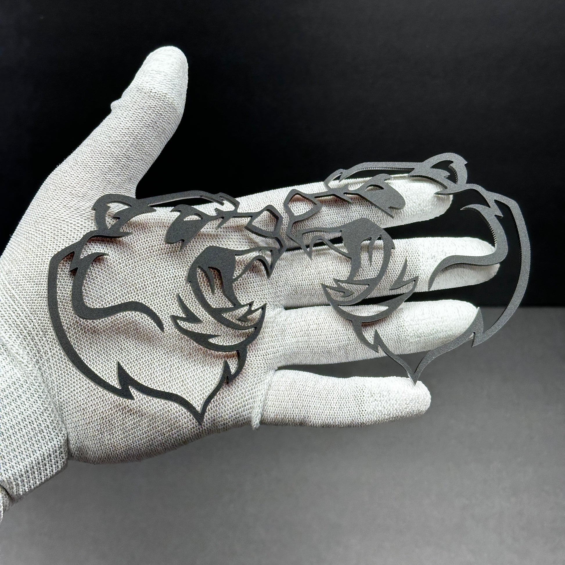 Bear head badge pair shown as custom vehicle fender emblem for automotive use