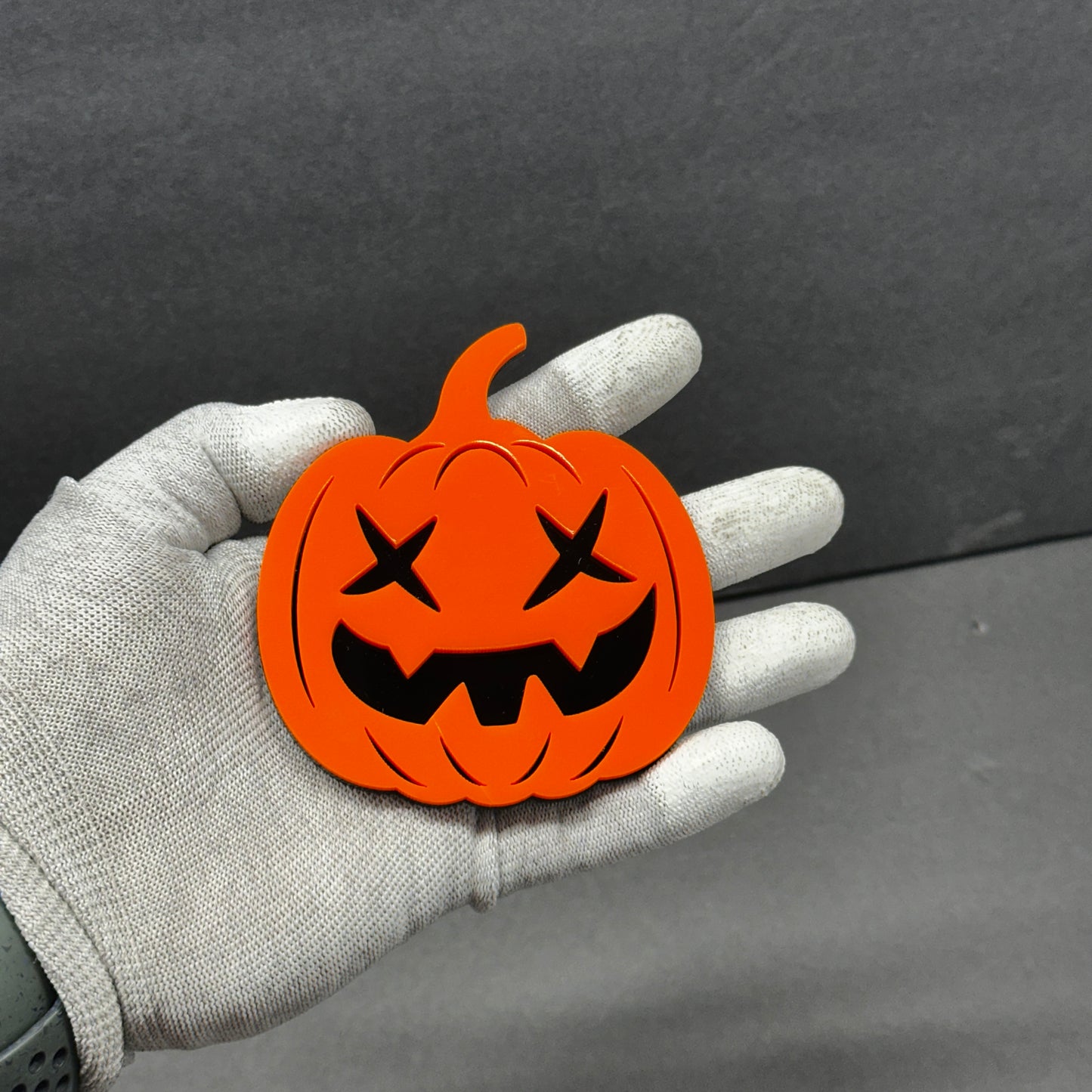 Orange Halloween pumpkin car badge fender emblem with black jack-o’-lantern face