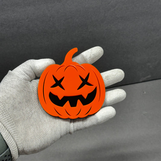 Orange Halloween pumpkin car badge fender emblem with black jack-o’-lantern face