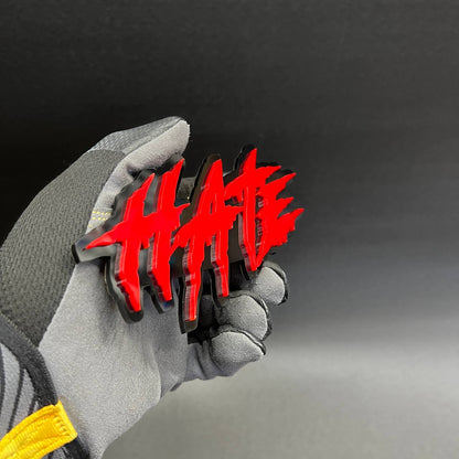 Custom text HATE badge designed for automotive exterior or interior decoration.
