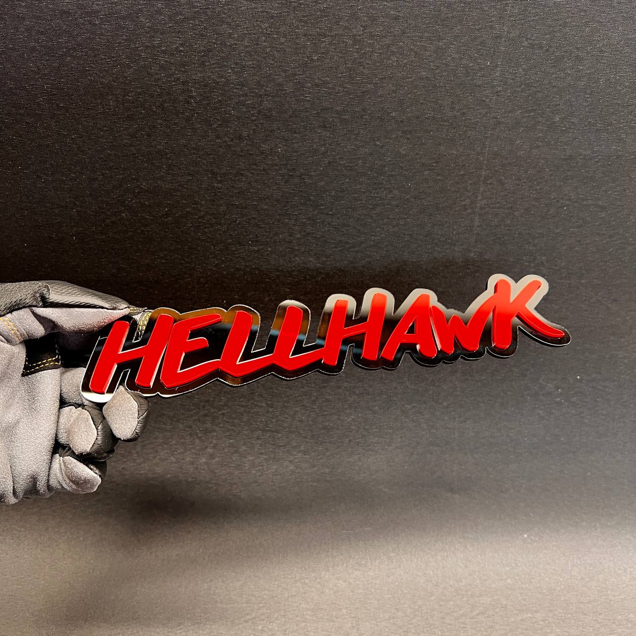Hell Hawk script style vehicle emblem with red top and black backing