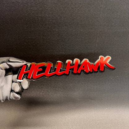 Hell Hawk script style vehicle emblem with red top and black backing