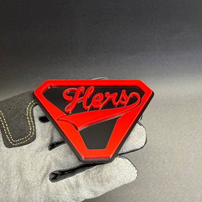 Hers superhero-inspired car emblem, decorative accessory for Ford Mustang, Chevrolet Camaro, Dodge Charger, RAM trucks, and Jeep Wrangler.