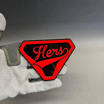 Women's Hers automotive emblem with bold red shield outline and glossy black background, personalized-style car accessory and gift idea