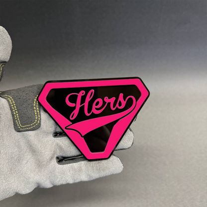 . Hers superhero-inspired car badge featuring glossy red lettering and a black shield background, custom automotive emblem for women.