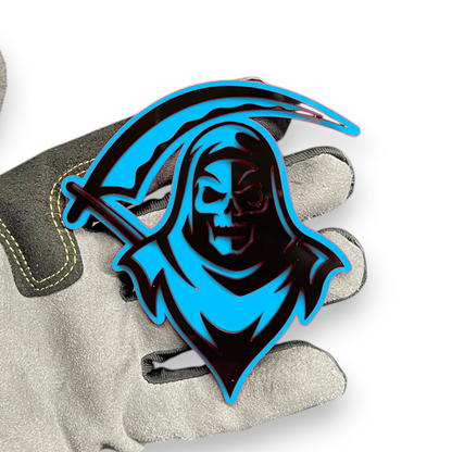 Reaper badge shown as custom vehicle fender emblem with hooded skull design