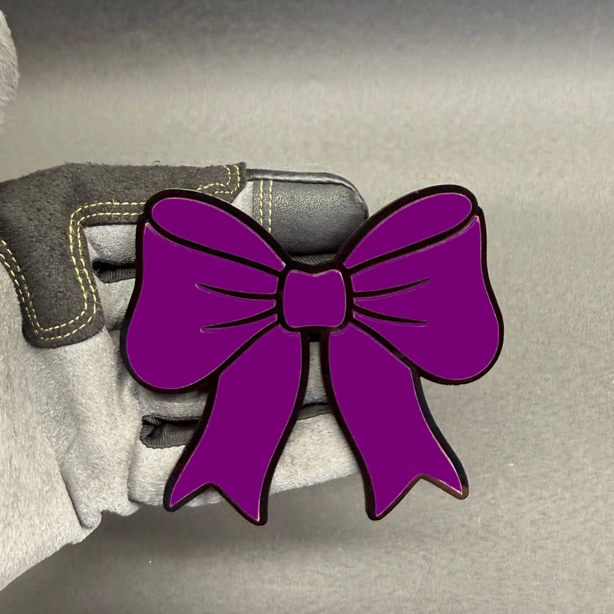 Bright pink bowtie decorative badge for Ford Bronco