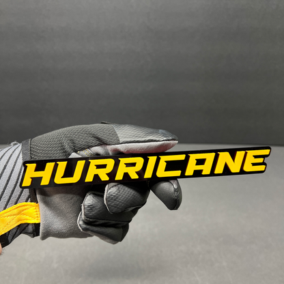 White Hurricane text badge for vehicle fender, tailgate, or grille installation.