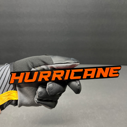 Hurricane custom automotive emblem with bold white lettering on black background.
