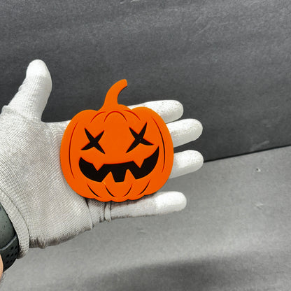Jack-o’-lantern car emblem in orange and black for truck exterior decoration