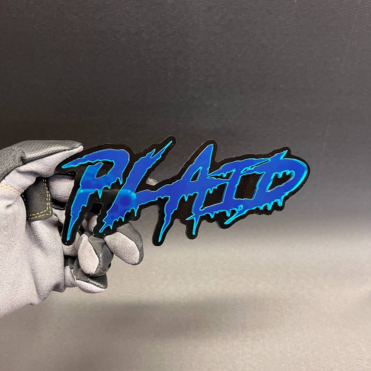 Custom PLAID text car exterior decal with aggressive lettering