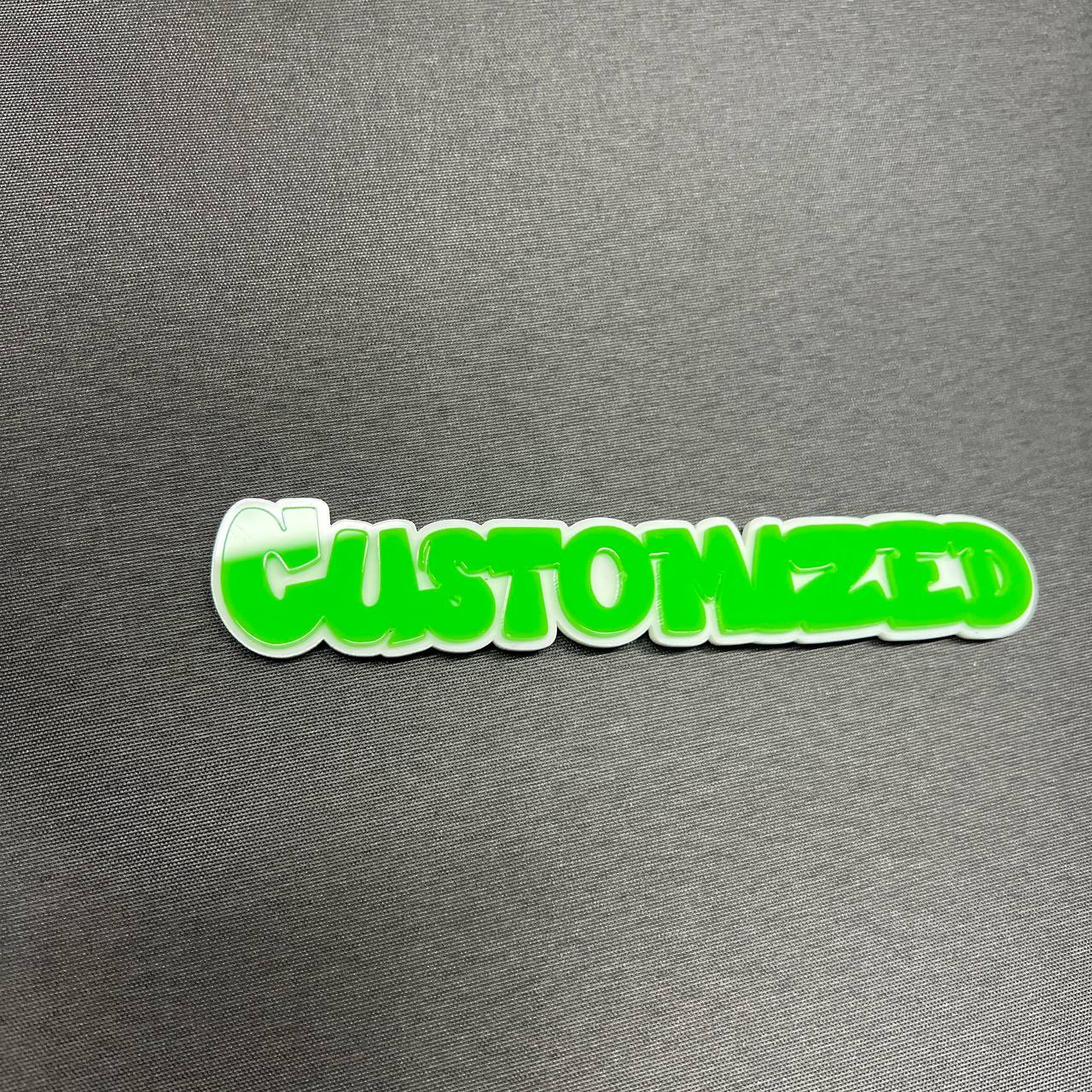 Personalized car badge emblem with bright green text and white border
