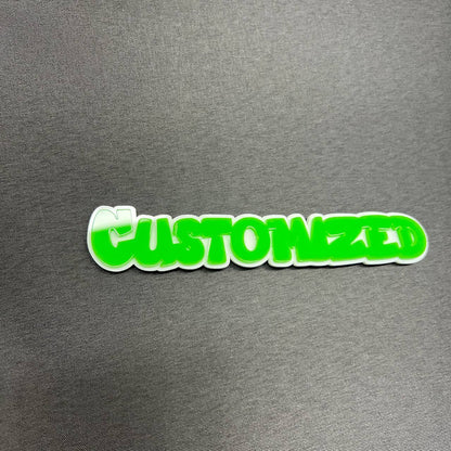 Personalized car badge emblem with bright green text and white border