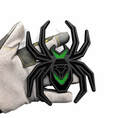 Matte black and green Black Widow spider hitch cover with layered custom automotive design.