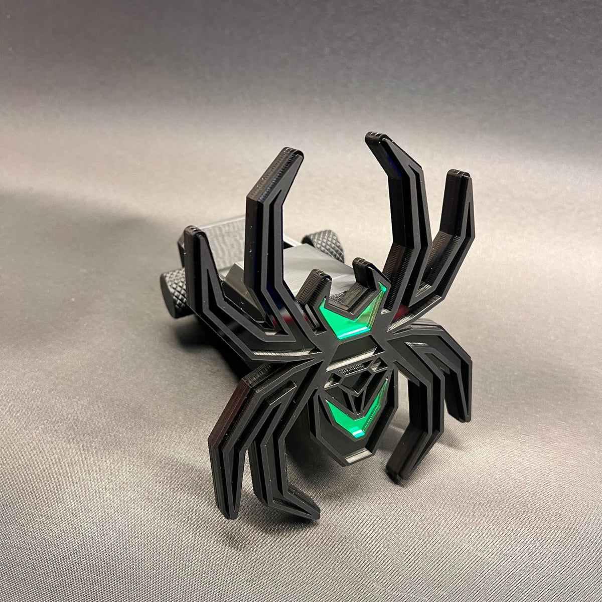 Custom Black Widow spider trailer hitch cover in matte black with bright poison green details.