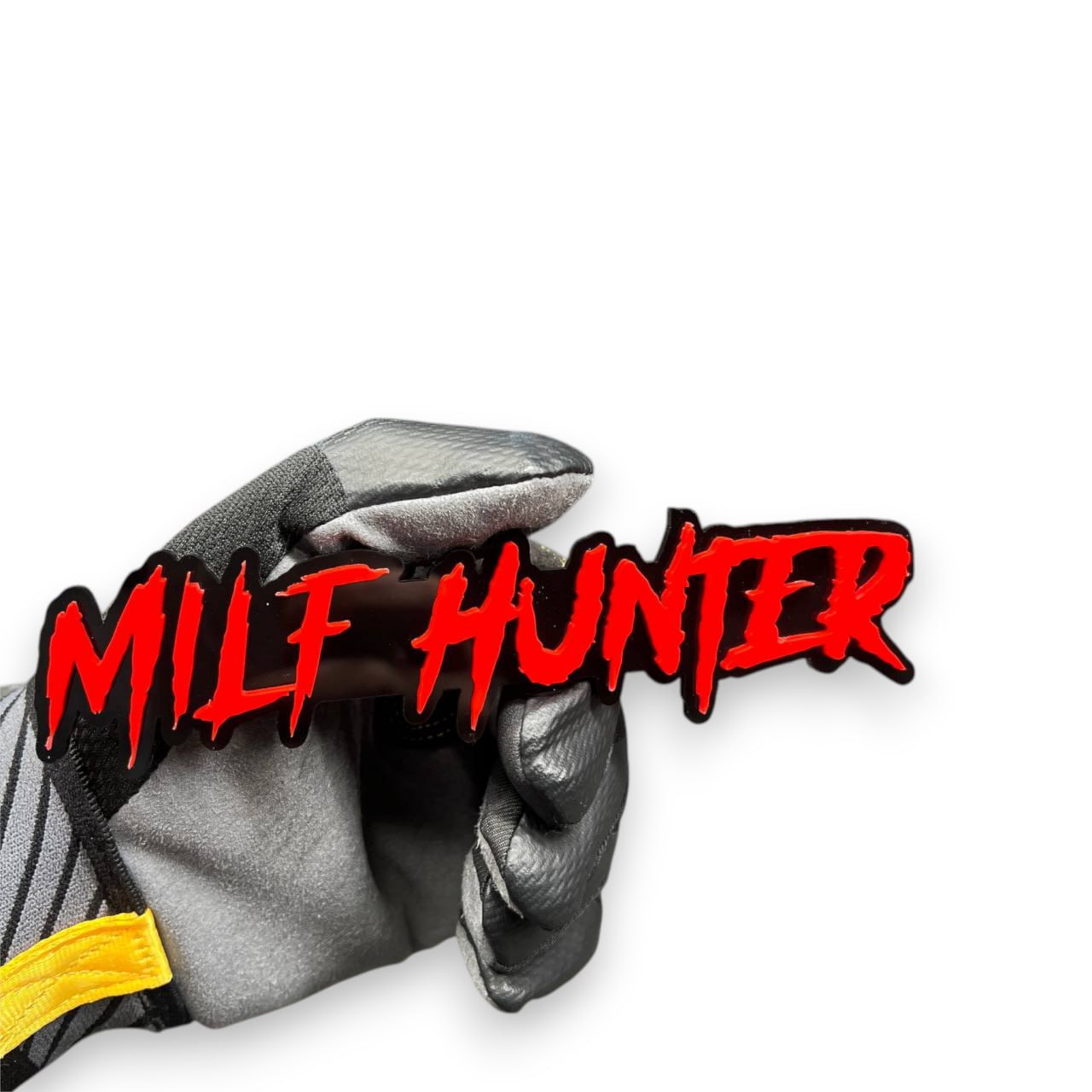 Milf Hunter custom automotive emblem red lettering on black acrylic for Tacoma