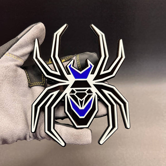 Gray on black Black Widow car badge with mirror blue accents for custom fender styling.