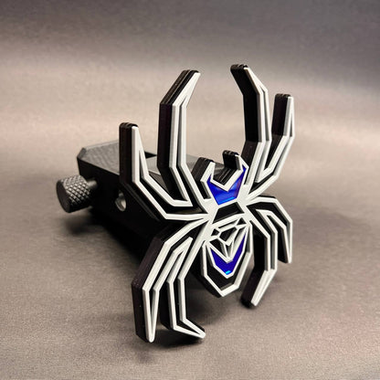 Mirror blue and gray Black Widow trailer hitch cover with layered black spider design.